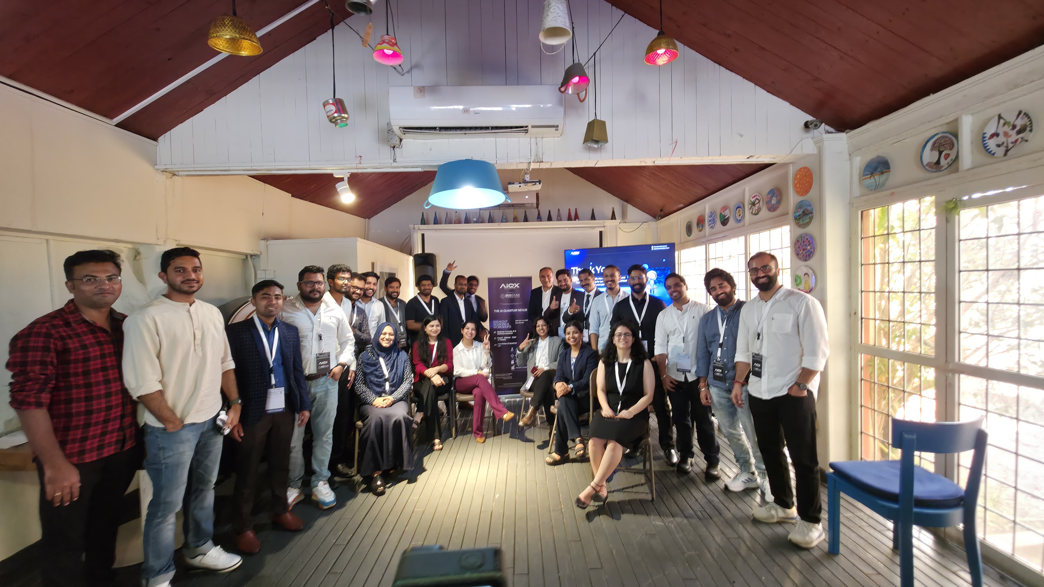 Large group photo of attendees and speakers